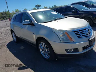 2014 Cadillac SRX Premium Collection z VIN 3GYFNDE35ES559804, wystawiony jako IAAI lot #41787428 z przebiegiem 120 617 mil mil oraz . Historia ofert i sprzedaży dostępna na DreamBid. Obrazek 1.