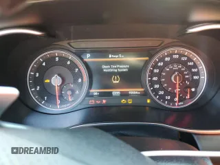 2020 Genesis G70 3.3T z VIN KMTG34LEXLU057731, wystawiony jako Copart lot #48794325 z przebiegiem 93 504 mil mil oraz Szkoda całkowita • Salvage title. Historia ofert i sprzedaży dostępna na DreamBid. Obrazek 9.