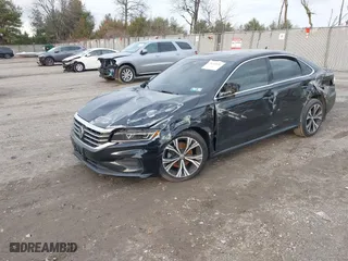 2021 Volkswagen Passat 2.0T SE with VIN 1VWSA7A34MC019031, listed as a IAAI auction lot 41150221 with 50,796 mi miles. Bid and sale history available at carsss.com. Image 2.
