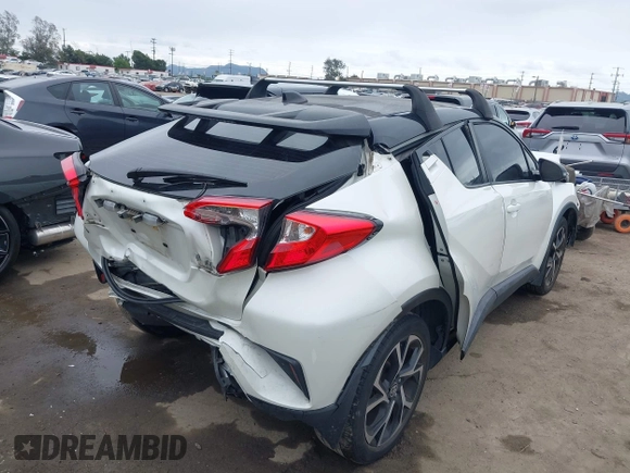 2020 Toyota C-HR LE with VIN JTNKHMBX9L1092934, listed as a IAAI auction lot 42021972 with 56,777 mi miles and . Bid and sale history available at DreamBid. Image 4.