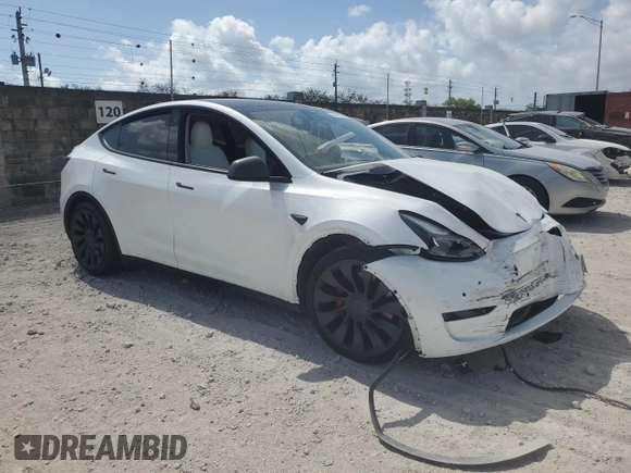 2022 Tesla Model Y Performance with VIN 7SAYGDEFXNF410531, listed as a Copart auction lot 54449715 with Not Provided miles and Non Repairable. Bid and sale history available at DreamBid. Image 4.