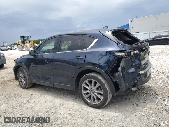 2021 Mazda CX-5 Grand Touring z VIN JM3KFBDM5M0464611, wystawiony jako Copart lot #62829065 z przebiegiem 20 525 mil mil oraz Nie do naprawy • Non repairable. Historia ofert i sprzedaży dostępna na DreamBid. Obrazek 2.