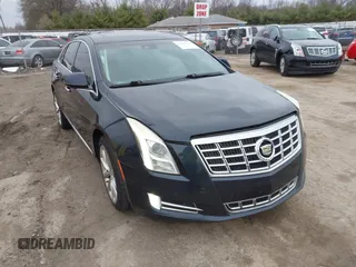 2013 Cadillac XTS Premium z VIN 2G61S5S30D9200779, wystawiony jako IAAI lot #41829124 z przebiegiem 187 656 mil mil oraz . Historia ofert i sprzedaży dostępna na DreamBid. Obrazek 1.