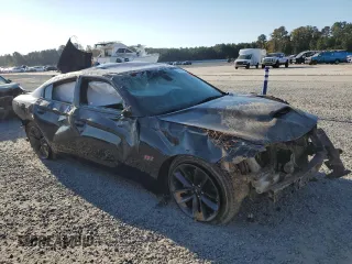 2019 Dodge Charger Scat Pack with VIN 2C3CDXGJ2KH697179, listed as a Copart auction lot 77311144 with 81,789 mi miles and Salvage Title. Bid and sale history available at DreamBid. Image 4.
