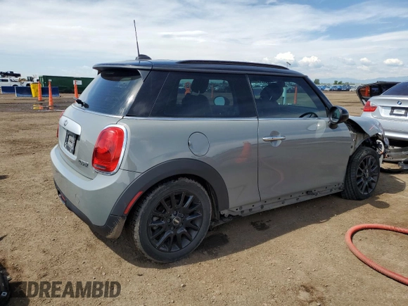2015 MINI Hardtop with VIN WMWXM5C5XFT974077, listed as a Copart auction lot 58063965 with 93,853 mi miles and Salvage title. Bid and sale history available at DreamBid. Image 3.