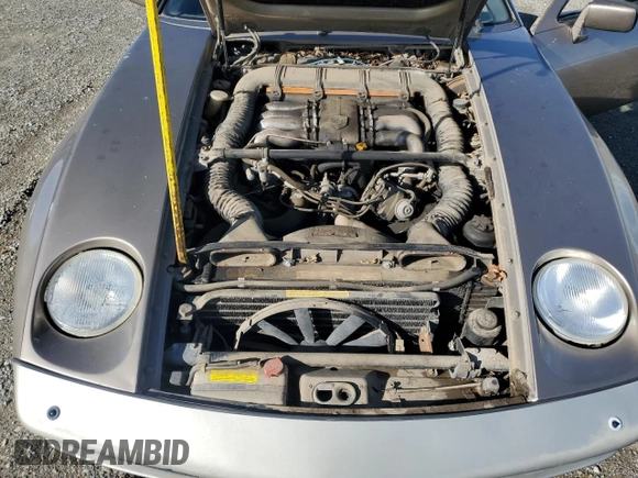 1984 Porsche 928 z VIN WP0JB0920ES860222, wystawiony jako Copart lot #44055645 z przebiegiem 166 689 mil mil oraz Nie do naprawy. Historia ofert i sprzedaży dostępna na DreamBid. Obrazek 11.