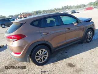 2017 Hyundai Tucson SE with VIN KM8J23A40HU525982, listed as a IAAI auction lot 41790898 with 107,715 mi miles. Bid and sale history available at carsss.com. Image 4.