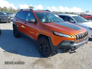 2014 Jeep Cherokee Trailhawk with VIN 1C4PJMBS4EW254879, listed as a IAAI auction lot 41550356 with 101,077 mi miles. Bid and sale history available at carsss.com. Image 1.