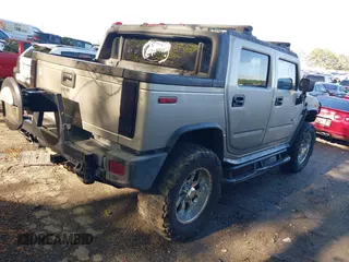 2005 Hummer H2 SUT with VIN 5GRGN22UX5H106653, listed as a IAAI auction lot 42015559 with 180,519 mi miles. Bid and sale history available at carsss.com. Image 4.
