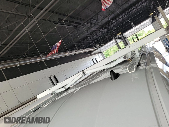 2023 Ford Transit Cargo with VIN 1FTBR1X86PKB99022, listed as a IAAI auction lot 42841650 with 14,234 mi miles and . Bid and sale history available at DreamBid. Image 22.