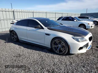 2017 BMW M6 z VIN WBS6E9C56HG437410, wystawiony jako Copart lot #80217694 z przebiegiem 68 335 mil mil oraz Szkoda całkowita • Salvage title. Historia ofert i sprzedaży dostępna na DreamBid. Obrazek 4.