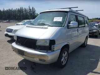 2003 Volkswagen EuroVan MV with VIN WV2NB47003H003131, listed as a IAAI auction lot 42157821 with 166,159 mi miles and . Bid and sale history available at DreamBid. Image 2.