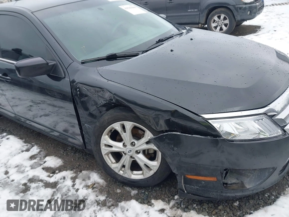 2012 Ford Fusion SE z VIN 3FAHP0HG2CR323380, wystawiony jako IAAI lot #41543660 z przebiegiem 169 059 mil mil oraz . Historia ofert i sprzedaży dostępna na DreamBid. Obrazek 6.