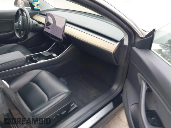 2019 Tesla Model 3 Mid Range with VIN 5YJ3E1EA5KF297213, listed as a IAAI auction lot 41361412 with 93,801 mi miles and . Bid and sale history available at carsss.com. Image 5.