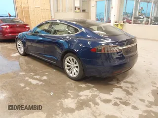 2018 Tesla Model S 75D with VIN 5YJSA1E24JF276044, listed as a IAAI auction lot 41798530 with 53,462 mi miles and . Bid and sale history available at DreamBid. Image 3.