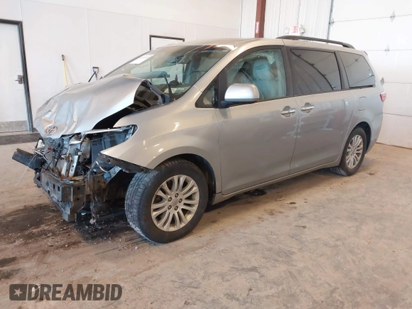 2015 Toyota Sienna XLE with VIN 5TDYK3DCXFS534633, listed as a IAAI auction lot 42018593 with 128,421 mi miles. Bid and sale history available at carsss.com. Image 17.