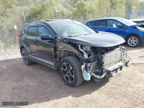 2017 Honda CR-V Touring with VIN 5J6RW2H96HL037854, listed as a IAAI auction lot 40472748 with 126,582 mi miles. Bid and sale history available at carsss.com. Image 1.