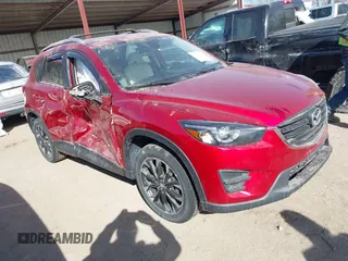 2016 Mazda CX-5 Grand Touring with VIN JM3KE4DY0G0709563, listed as a IAAI auction lot 41886956 with 156,769 mi miles. Bid and sale history available at carsss.com. Image 1.
