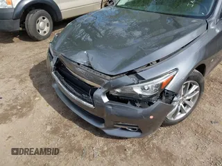 2015 Infiniti Q50 Premium z VIN JN1BV7AR1FM398047, wystawiony jako IAAI lot #42203862 z przebiegiem 104 002 mil mil oraz . Historia ofert i sprzedaży dostępna na DreamBid. Obrazek 6.