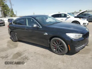 2014 BMW 5 Series GT 550i xDrive with VIN WBA5M0C5XED084908, listed as a Copart auction lot 50619945 with 97,680 mi miles and Salvage Title. Bid and sale history available at carsss.com. Image 4.