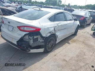 2016 Ford Fusion Titanium with VIN 3FA6P0K99GR317034, listed as a IAAI auction lot 42590288 with 200,468 mi miles and . Bid and sale history available at DreamBid. Image 6.