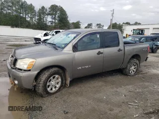 2006 Nissan Titan LE z VIN 1N6BA07B36N519453, wystawiony jako Copart lot #84962124 z przebiegiem 223 881 mil mil oraz Szkody całkowita. Historia ofert i sprzedaży dostępna na DreamBid. Obrazek 1.
