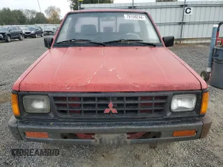 1991 Mitsubishi Mighty Max z VIN JA7FL24W2MP026041, wystawiony jako Copart lot #79159244 z przebiegiem 219 903 mil mil oraz Szkody całkowita. Historia ofert i sprzedaży dostępna na DreamBid. Obrazek 5.