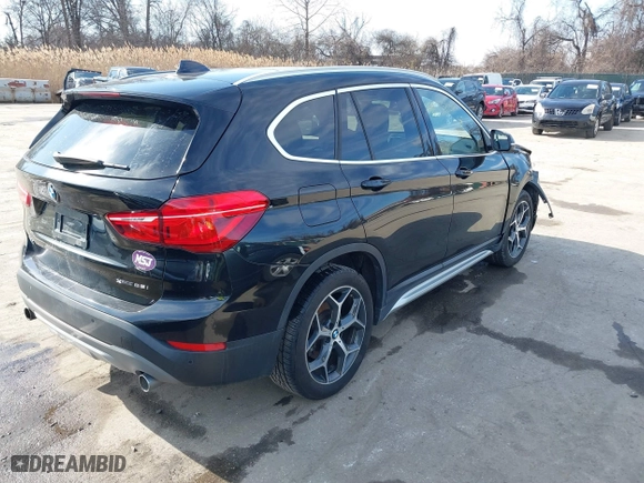 2019 BMW X1 xDrive28i with VIN WBXHT3C51K5L89758, listed as a IAAI auction lot 41535652 with 96,612 mi miles. Bid and sale history available at carsss.com. Image 4.