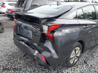 2021 Toyota Prius L Eco with VIN JTDKAMFU2M3143138, listed as a IAAI auction lot 41658263 with 102,718 mi miles. Bid and sale history available at carsss.com. Image 6.