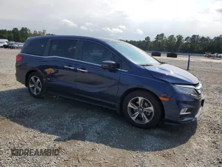 2020 Honda Odyssey Touring with VIN 5FNRL6H85LB003302, listed as a Copart auction lot 72709924 with 58,228 mi miles and Salvage Title. Bid and sale history available at DreamBid. Image 4.