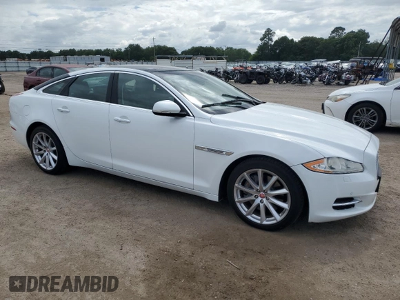 2015 Jaguar XJ with VIN SAJWA1CZ9F8V82974, listed as a Copart auction lot 59364344 with 64,012 mi miles and Salvage Title. Bid and sale history available at carsss.com. Image 4.