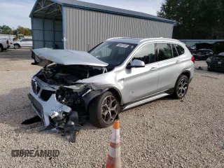 2017 BMW X1 sDrive28i with VIN WBXHU7C30H5H37516, listed as a Copart auction lot 68677332 with 0 mi miles. Bid and sale history available at carsss.com. Image 1.