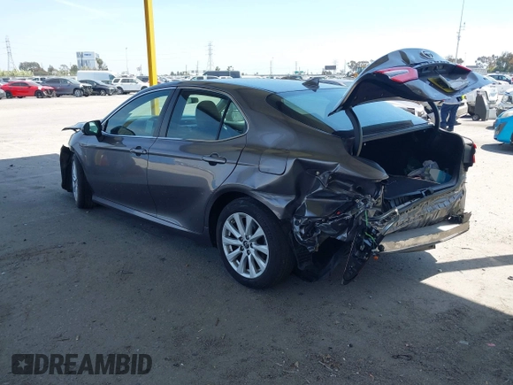 2019 Toyota Camry LE with VIN 4T1B11HK8KU204599, listed as a IAAI auction lot 42096889 with 76,518 mi miles and . Bid and sale history available at DreamBid. Image 3.