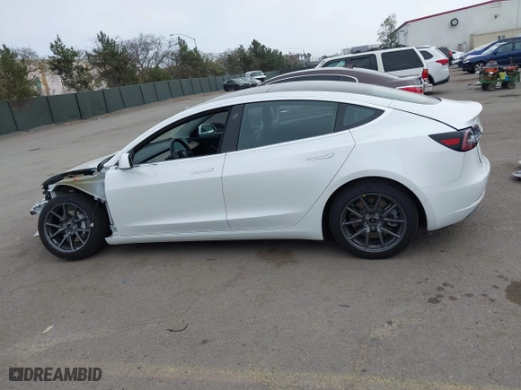 2019 Tesla Model 3 Long Range with VIN 5YJ3E1EB2KF361541, listed as a IAAI auction lot 41859373 with 54,664 mi miles. Bid and sale history available at carsss.com. Image 15.