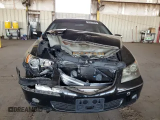 2005 Acura RL z VIN JH4KB16575C011187, wystawiony jako Copart lot #60276655 z przebiegiem 107 378 mil mil oraz Szkoda całkowita • Salvage title. Historia ofert i sprzedaży dostępna na DreamBid. Obrazek 5.