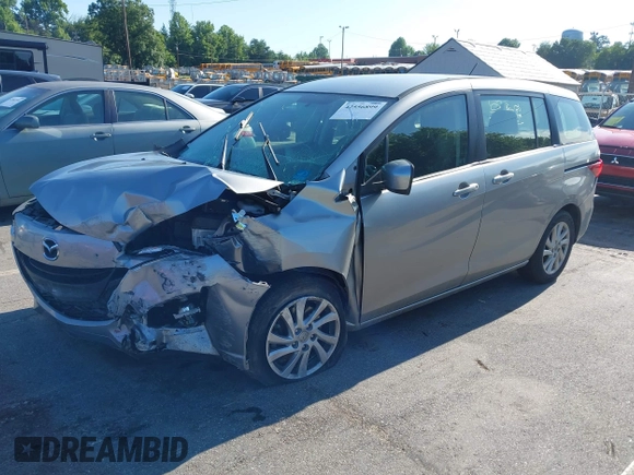2012 Mazda 5 Sport with VIN JM1CW2BLXC0129303, listed as a IAAI auction lot 42556899 with 200,863 mi miles and . Bid and sale history available at DreamBid. Image 18.