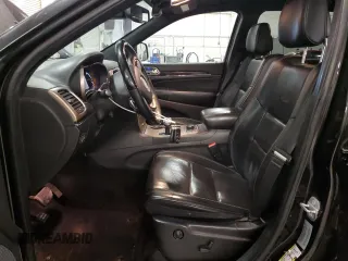 2015 Jeep Grand Cherokee Overland with VIN 1C4RJFCG7FC911899, listed as a Copart auction lot 54123925 with 243,031 mi miles and Salvage Title. Bid and sale history available at carsss.com. Image 7.