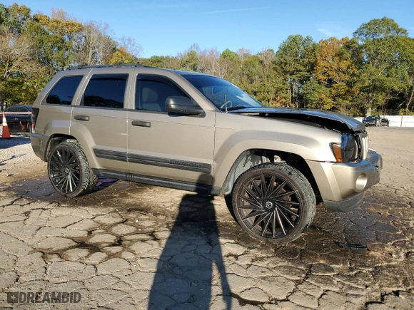 2005 Jeep Grand Cherokee Laredo with VIN 1J4HS48N65C732587, listed as a Copart auction lot 80656084 with 214,037 mi miles and Salvage Title. Bid and sale history available at carsss.com. Image 4.