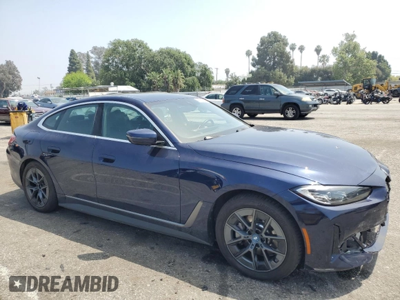 2023 BMW i4 eDrive40 with VIN WBY73AW09PFN76758, listed as a Copart auction lot 48096254 with 9,909 mi miles. Bid and sale history available at carsss.com. Image 4.