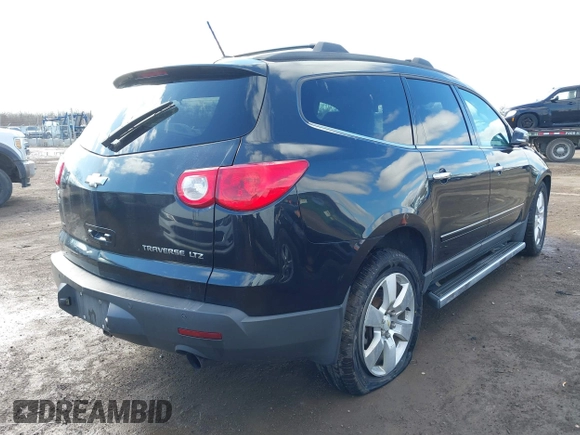 2011 Chevrolet Traverse LTZ with VIN 1GNKVLED5BJ197551, listed as a IAAI auction lot 41800519 with 205,771 mi miles and . Bid and sale history available at DreamBid. Image 4.