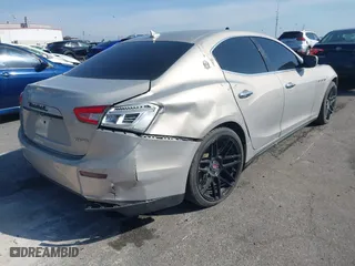 2014 Maserati Ghibli S Q4 with VIN ZAM57RTA8E1095303, listed as a IAAI auction lot 41600587 with 98,215 mi miles. Bid and sale history available at carsss.com. Image 4.