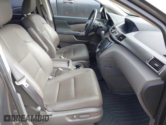 2015 Honda Odyssey Touring Elite z VIN 5FNRL5H97FB060981, wystawiony jako IAAI lot #42289631 z przebiegiem 160 947 mil mil oraz . Historia ofert i sprzedaży dostępna na DreamBid. Obrazek 5.