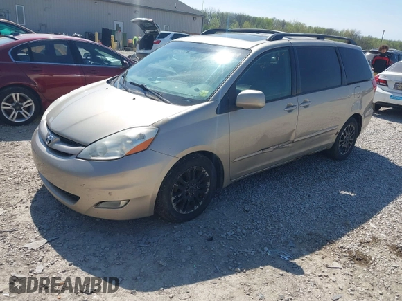 2009 Toyota Sienna XLE with VIN 5TDZK22CX9S257522, listed as a IAAI auction lot 42113875 with 214,873 mi miles. Bid and sale history available at carsss.com. Image 2.