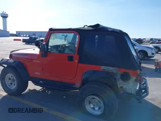 2005 Jeep Wrangler Sport with VIN 1J4FA49S85P344204, listed as a IAAI auction lot 41769319 with 105,927 mi miles. Bid and sale history available at carsss.com. Image 6.
