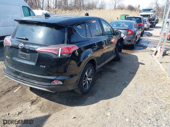 2018 Toyota RAV4 XLE with VIN 2T3WFREV6JW477658, listed as a IAAI auction lot 41706807 with 146,829 mi miles. Bid and sale history available at carsss.com. Image 4.