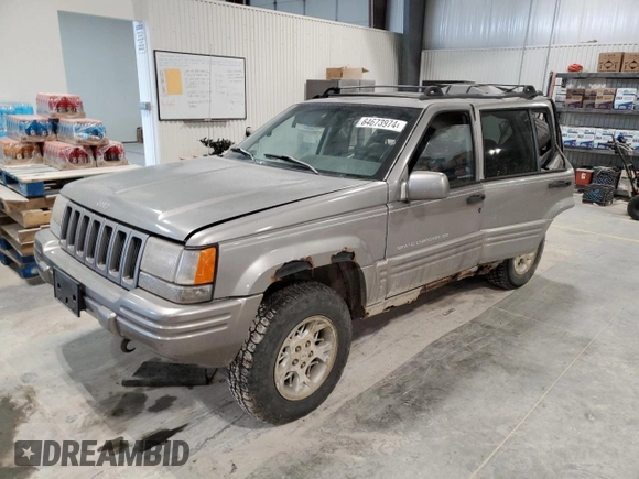 1997 Jeep Grand Cherokee Limited with VIN 1J4GZ78Y4VC589688, listed as a Copart auction lot 84673974 with 183,930 mi miles and Salvage Title. Bid and sale history available at carsss.com. Image 1.
