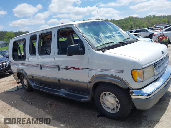 1999 Ford Econoline Cargo Recreational with VIN 1FDRE14L2XHA41059, listed as a IAAI auction lot 42067879 with 149,185 mi miles. Bid and sale history available at carsss.com. Image 13.