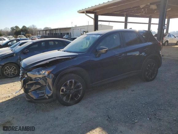 2016 Mazda CX-5 Grand Touring with VIN JM3KE4DY4G0810847, listed as a Copart auction lot 88032965 with 122,961 mi miles and Salvage Title. Bid and sale history available at carsss.com. Image 1.