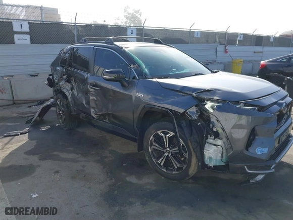2021 Toyota RAV4 Prime XSE with VIN JTMFB3FV7MD009740, listed as a IAAI auction lot 41666510 with 59,950 mi miles. Bid and sale history available at carsss.com. Image 6.