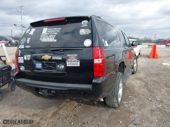 2013 Chevrolet Suburban LT with VIN 1GNSKJE70DR284785, listed as a IAAI auction lot 41838484 with 113,696 mi miles. Bid and sale history available at carsss.com. Image 4.